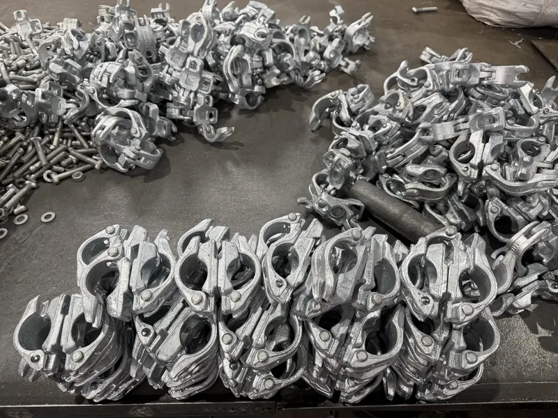 Coupler bodies laid out on the factory floor next to a pile of bolts