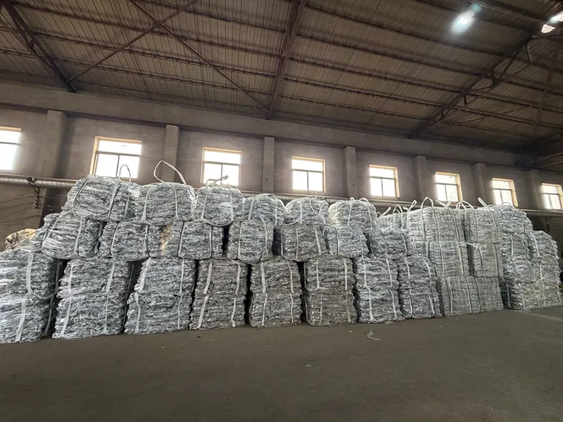 Rows of woven bags filled with couplers stacked in a warehouse
